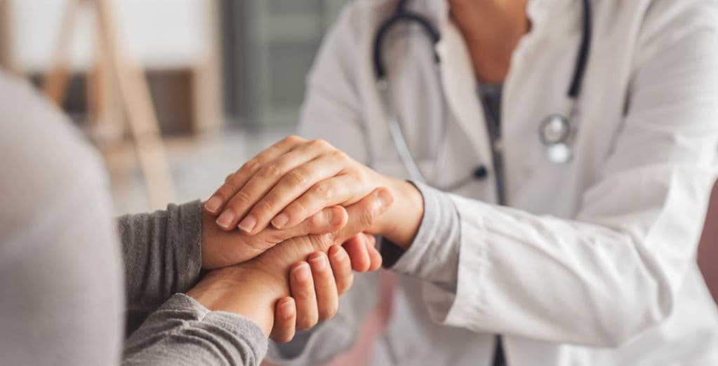 Dr. Milton Chavez with a patient at Illari Health